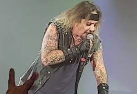 Motley Crue singer Vince Neil breaks ribs after falling off stage